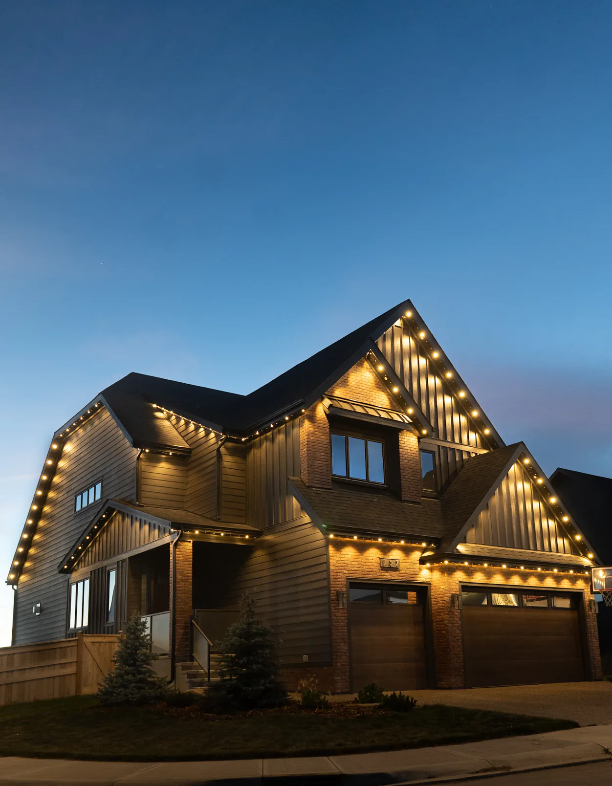 Architectural lighting tracing the details of a home's roofline