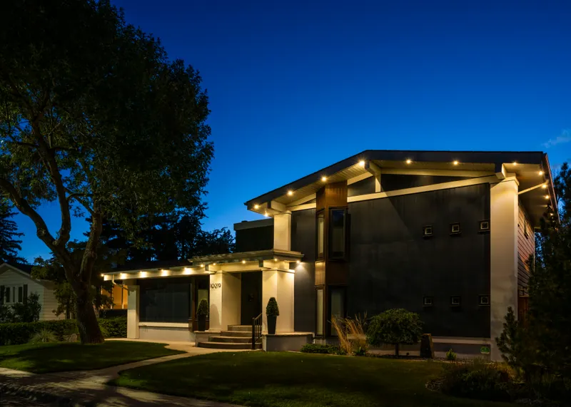 Clean warm lines tracing the flat roof of a modern home