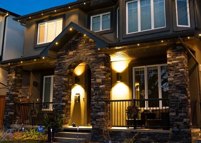 Soft warm white over a stone entry and porch
