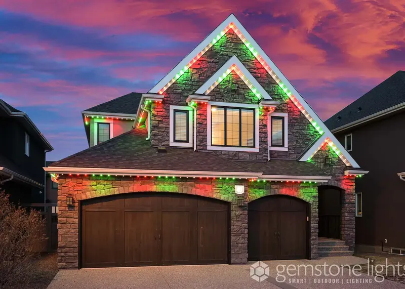 Red and green on a brick and siding home at sunset