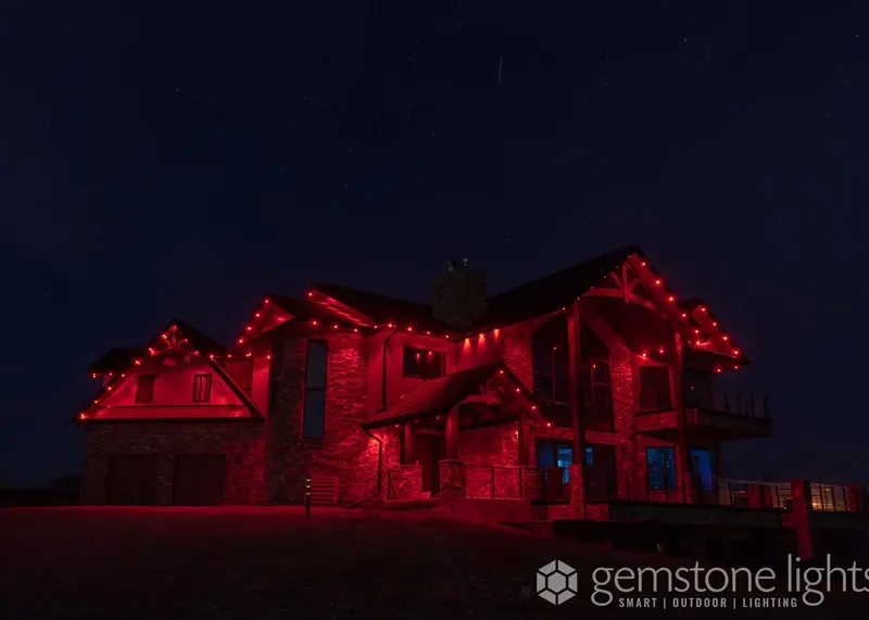 Deep red-orange glow across a timber-frame home