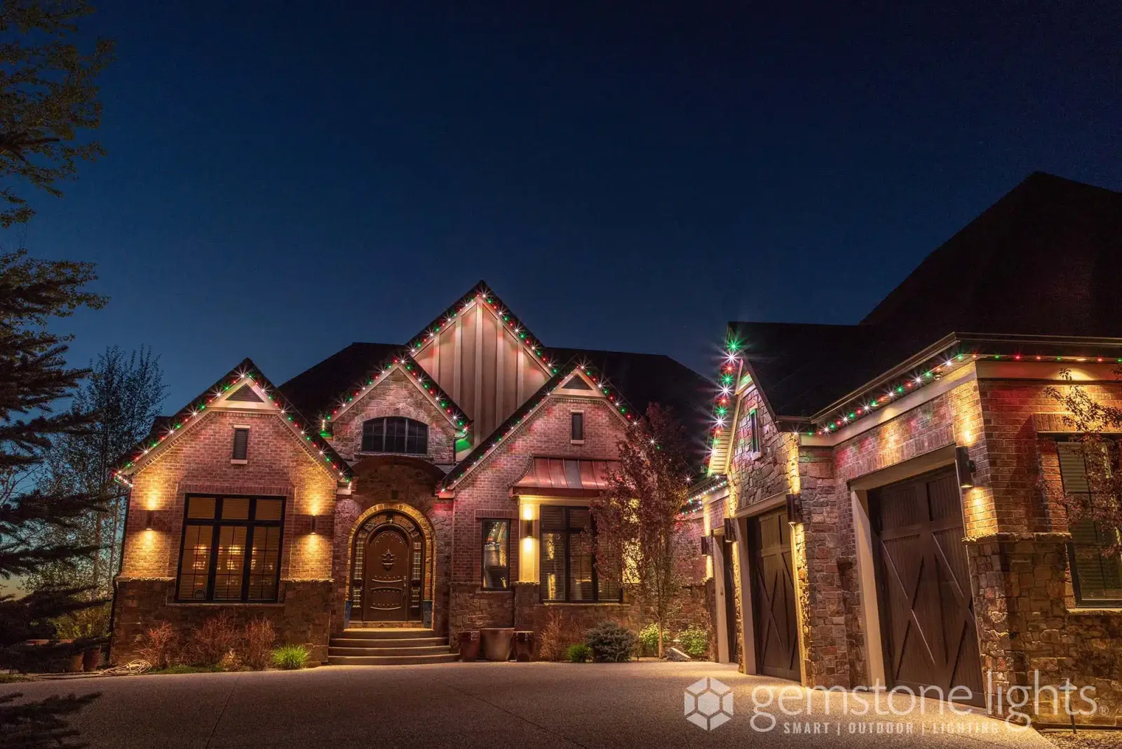 Stone home with lit gables