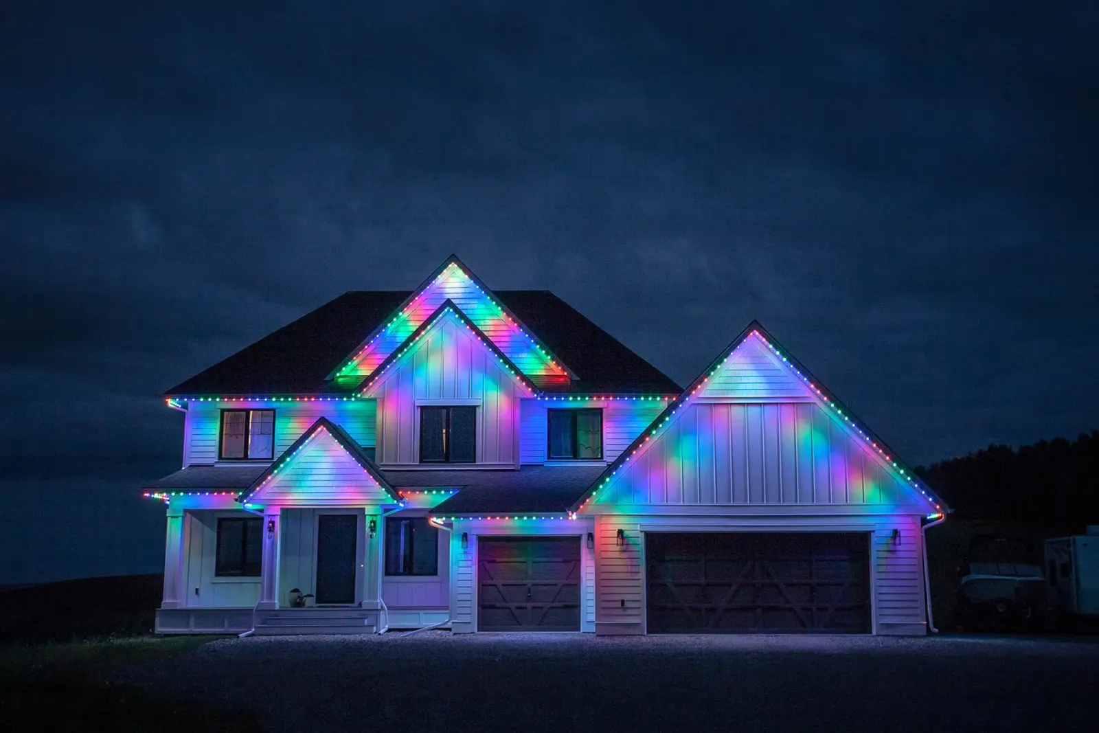 House glowing in a rainbow of holiday colors